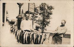 Men With String of Fish Postcard