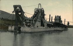 One of the dredges at work in the Canal,scooping up mud from the bottom. Postcard