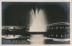 "GeSoLei at Night", restaurant with light fountain Postcard