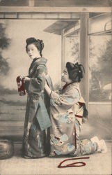 Geisha helping her friend with kimono Postcard