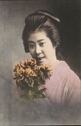 A young lady holding a Chrysanthemum Postcard