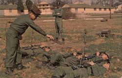 Basic trainees crawl under barbed wire in infiltration course exercise. Fort Leonard Wood, MO Postcard Postcard Postcard