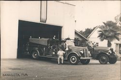 A Man Sitting on the Side of a Fire Truck Sarasota, FL Postcard Postcard Postcard