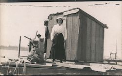 Woman and Two Men on Dock Postcard