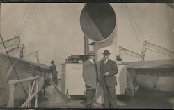 Snapshot of Two Men on Deck of Steamer Postcard