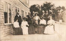 A Group of Men and Women Posing on a Balcony Postcard