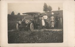 A Family Standing Next to a Car Cars Postcard Postcard Postcard