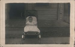 Baby in Stroller in front of house Postcard