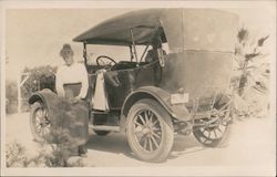 Snapshot of Woman by Automobile Postcard