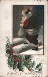 A Merry Christmas - Santa Carrying a Tree and a Bag Postcard