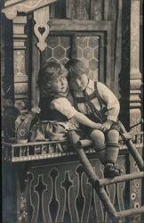 Two Toddlers in Window Holding Hands Postcard