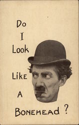 Head of a man wearing a derby hat and cigar stump in mouth with text: "Do I Look Like A Bonehead?" Postcard