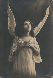 Dark-Haired Angel with long white gown Postcard