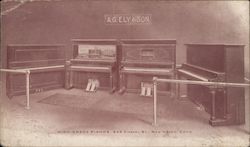 Four Upright Pianos at A.G. Ely and Son Postcard