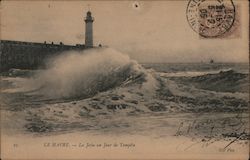 A lighthouse on the French coast buffeted by the waves Le Havre, France Postcard Postcard Postcard