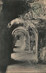 Woman seated in an abbey corridor France Postcard Postcard Postcard