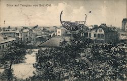 A river lined with scrub and houses Postcard