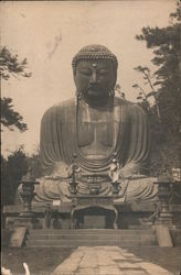 Large statue of the Buddha with trees in the background Japan Postcard Postcard Postcard