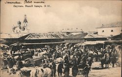 Open market with people, oxcarts and an onion dome in the background Postcard