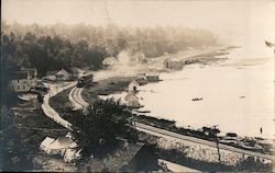 Train Running on Tracks Along Water Railroad (Scenic) Postcard Postcard Postcard