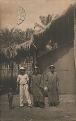 Posing Villagers - Thatched Roof House Postcard