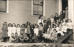 Children Lined Up in Front of a Schoolhouse Postcard