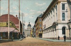 Exchange St. Post Office on the Right. City Hall in the Distance Postcard