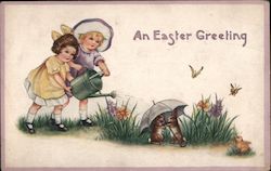 An Easter Greeting - Two Girls Watering Flowers, Bunnies Under Umbrella Postcard