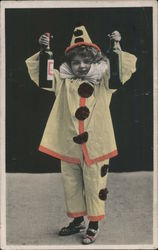 Boy in clown costume holding bottles Postcard