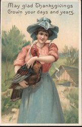 Woman holding a turkey Postcard