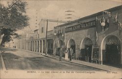 Biskra.- Le cafe Glacier et la Rue du Cardinal-Lavigerie Postcard