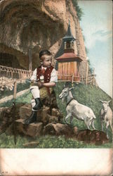 Boy sitting on a rock with two goats Postcard