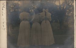 Three women circa 1900 clothing, back view Postcard