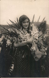 Woman With an Armload of Flowers in a Field of Iris Postcard Postcard Postcard