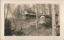 2 story home on a hill in the woods with a shed and trees Indian Lake, NY Postcard Postcard Postcard