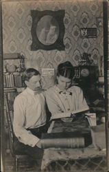 Couple Reading at Table Postcard