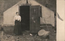 Woman in front of Tent Cabin Postcard