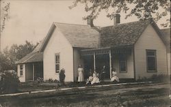 Family in front of House Postcard