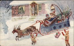 Santa and his Reindeer in Front of a House Postcard