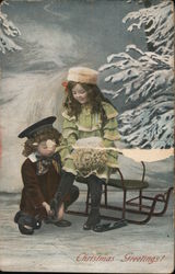 Christmas Greetings - A Girl Sitting on a Sled While a Boy Helps her put her Shoes on Postcard