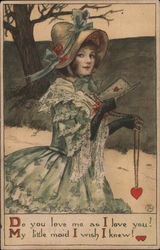 Girl in a bonnet holding a Valentine's Day card and a necklace with a heart on it Postcard