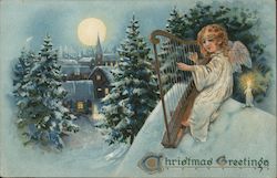 Christmas Greetings - An Angel Playing a Harp in the Snow Postcard