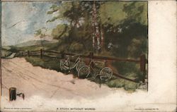 Bicycles Leaning Against a Fence near Trees Postcard