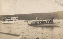 Cruise boats loaded with passengers on lake Postcard