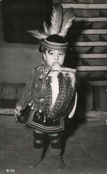 Young Indian Warrior in native outfit with feathers Postcard