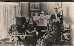 Family Band in parlor around piano Postcard