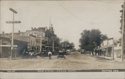 Main Street Looking North - Carl Held's Drug Store Postcard