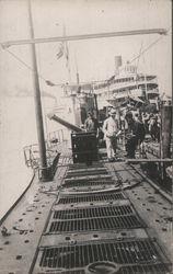 Men on docked WWI-era Submarine Ships Postcard Postcard Postcard