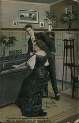 Woman in evening gown playing piano while a man in a tux watches Postcard