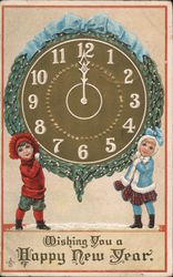 Boy and Girl holding overlarge clock set for 12 midnight Postcard